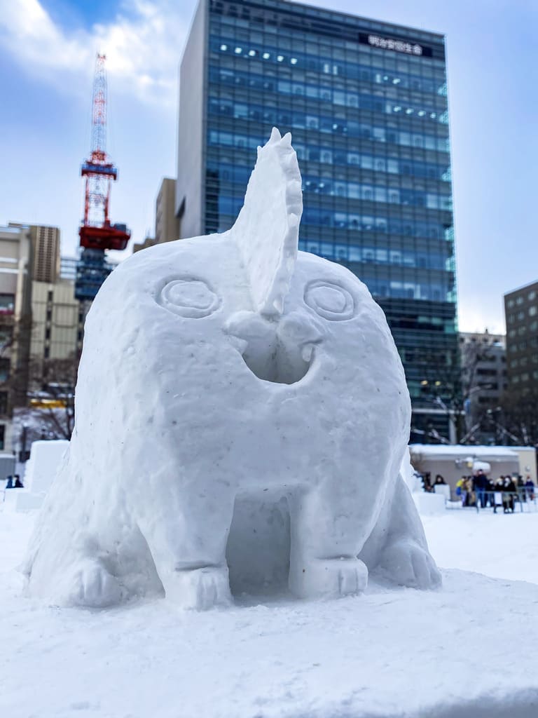 Snow sculpture of Pochita from Chainsaw Man at Sapporo Snow Festival (Yuki Matsuri)