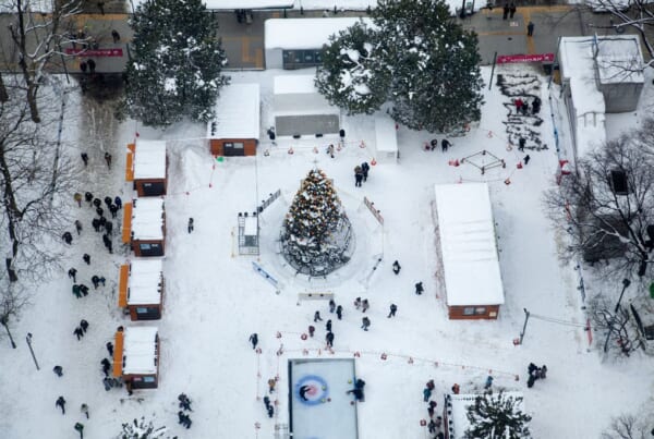 Xmas tree and shops below Sapporo TV Tower at at Sapporo Snow Festival (Yuki Matsuri)