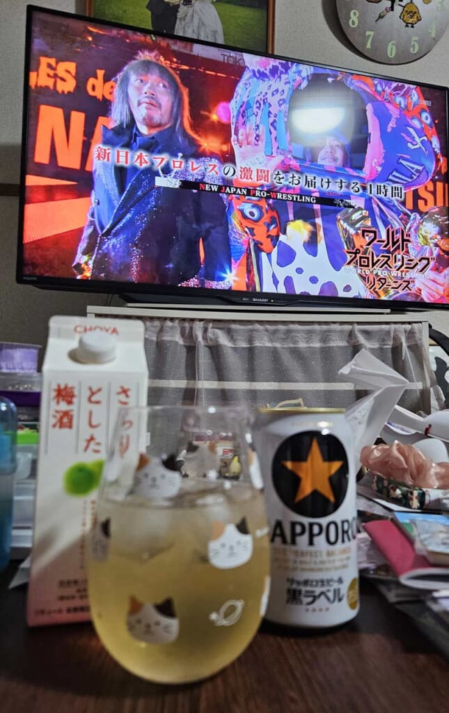 Watching wrestling and drinking.