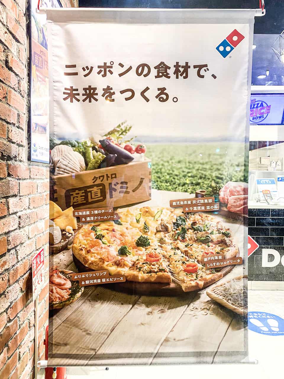 Cartel publicitario Domino's Pizza
